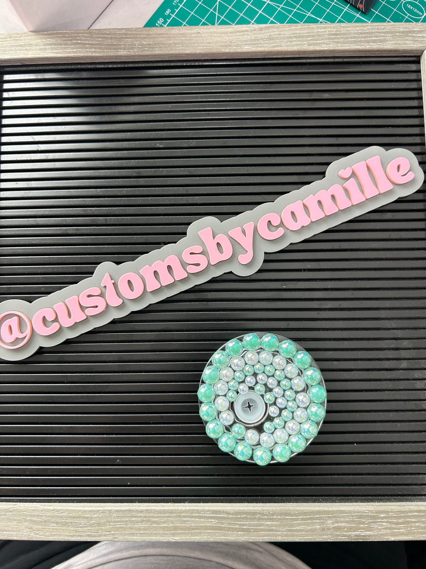 Green and white beaded lid