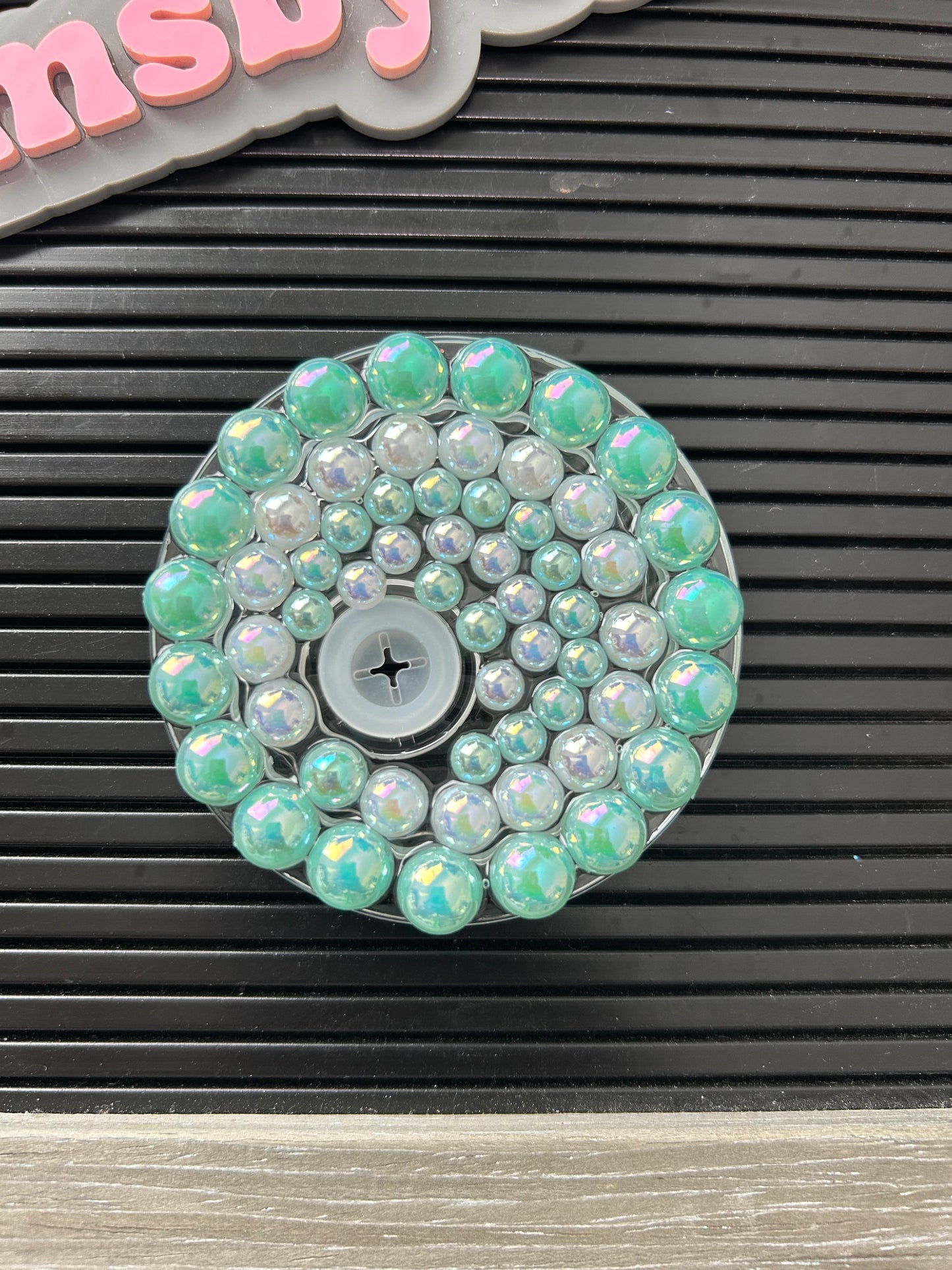Green and white beaded lid